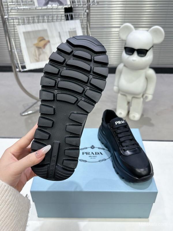 2025 Unisex Prada Black Leather Sneakers KFY00310